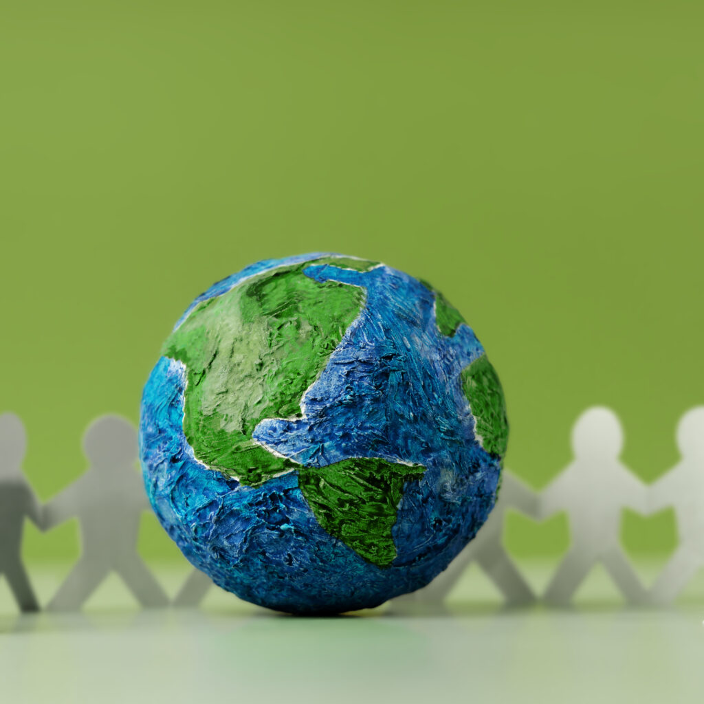 "Global unity concept with paper figures around Earth, representing a Sage Intacct Partner supporting nonprofits.