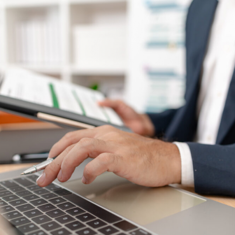 Businessman analysing financial charts to evaluate Sage accounting software performance