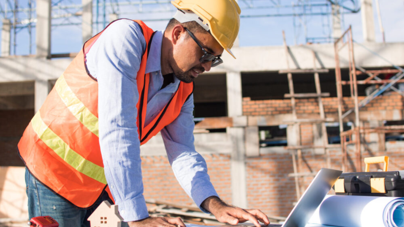 Construction worker using Sage Construction Software in the UK on-site