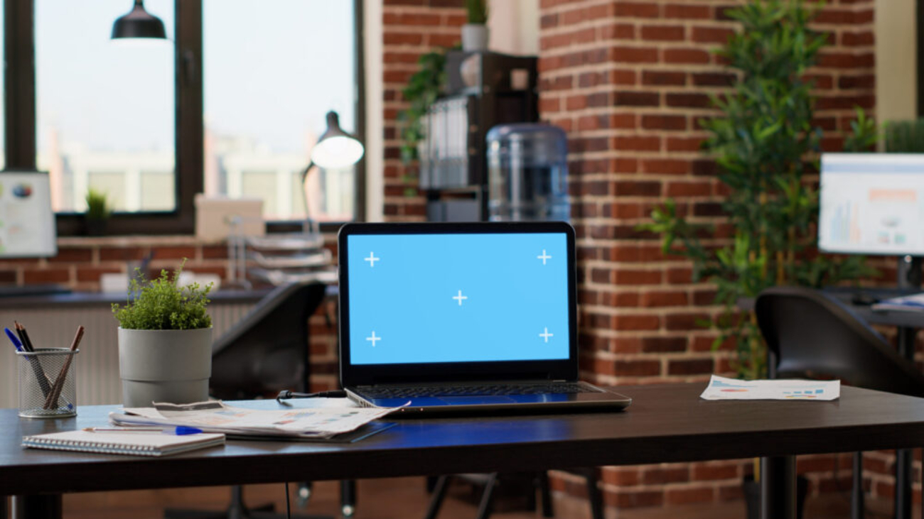 Office workspace with computer screens used during a Sage 200 upgrade and system update planning