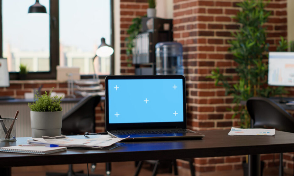 Office workspace with computer screens used during a Sage 200 upgrade and system update planning